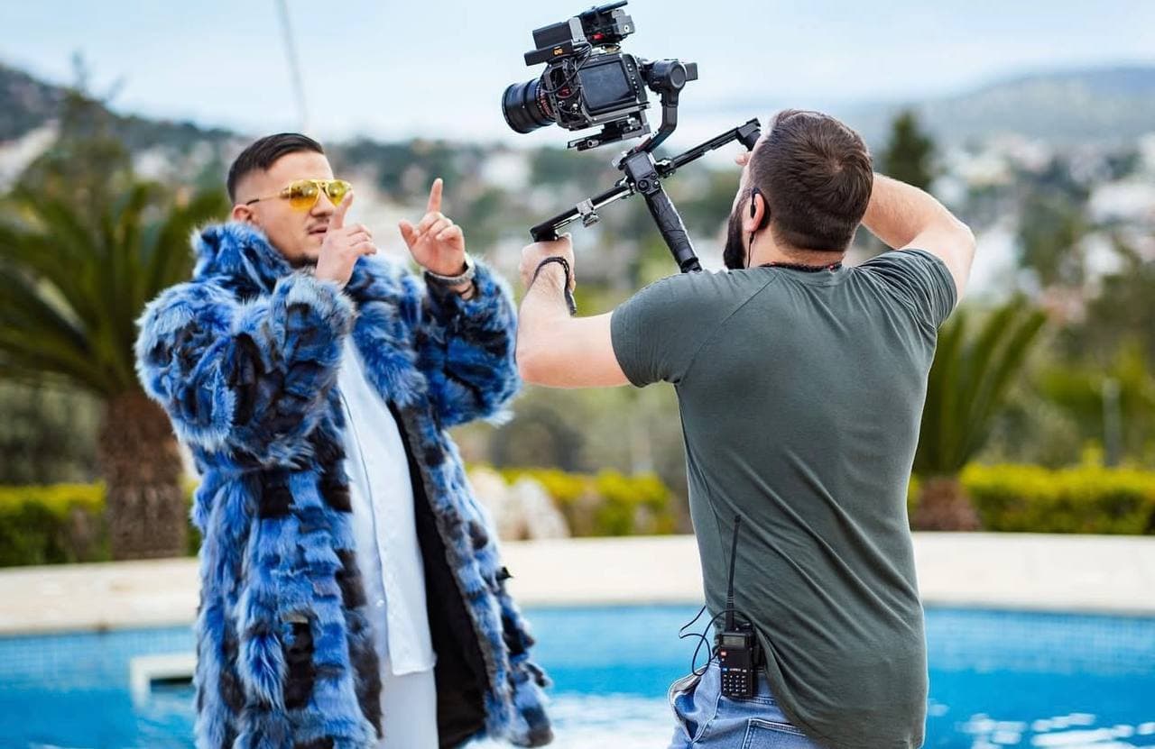 Music video production by the pool